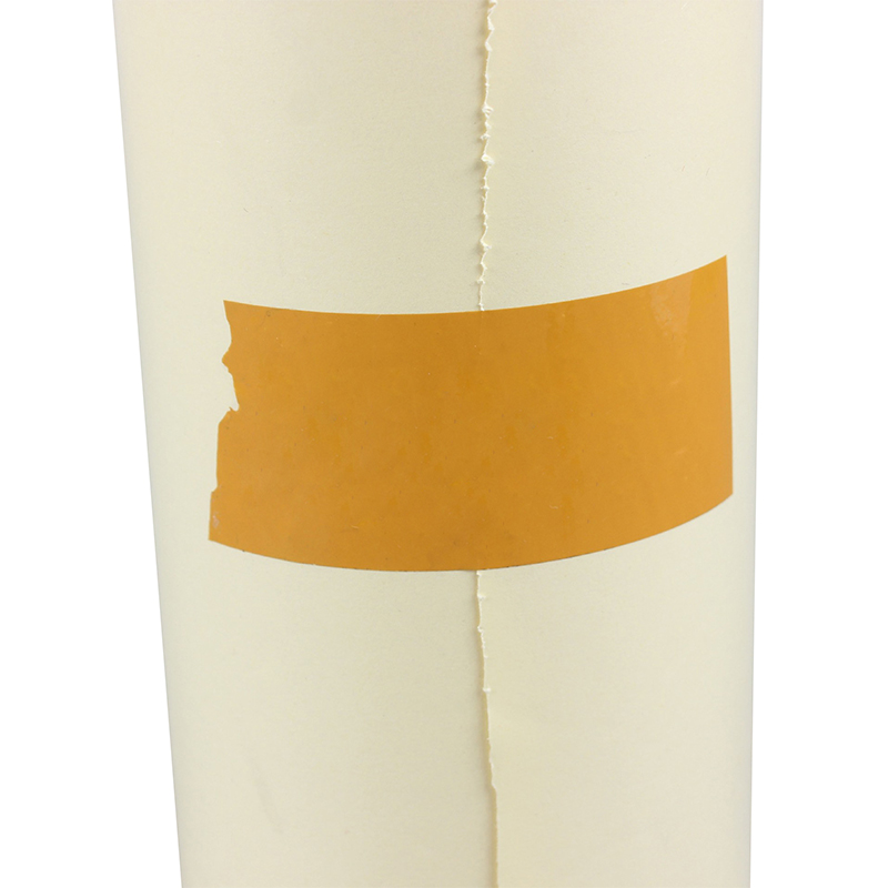 How does yellow silicone paper improve the adhesion of labels and stickers?